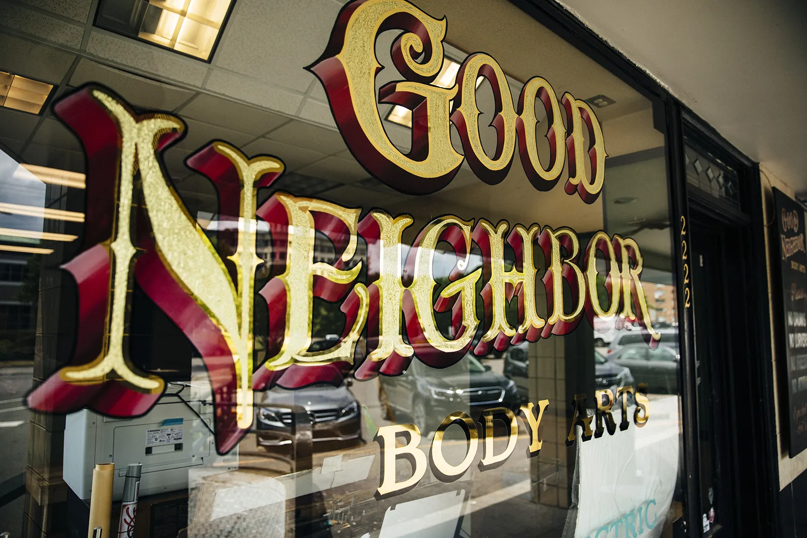 gilded window sign with damar centers and blended shadow - birmingham alabama 5 points neighborhood