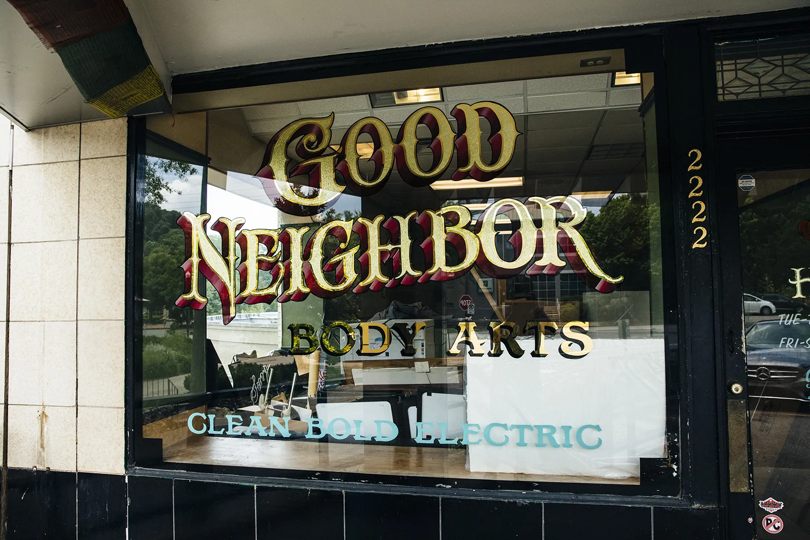 gilded window sign with damar centers and blended shadow - birmingham alabama 5 points neighborhood - front view