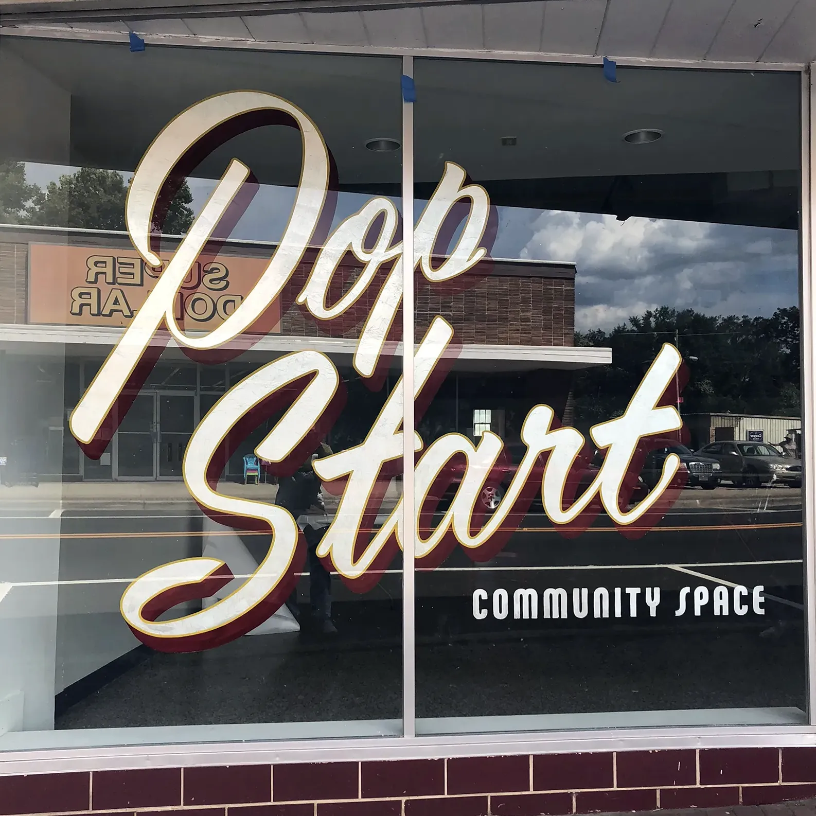 gilded window sign - reverse on glass - custom script lettering - York Alabama - west alabama